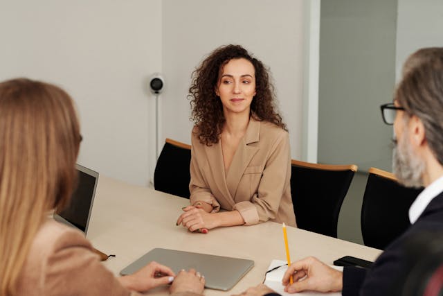 three-people-talking-at-table